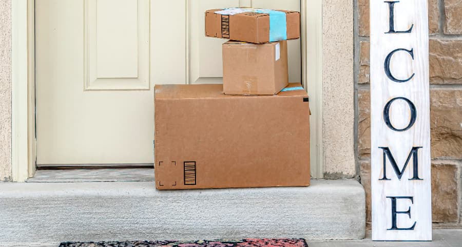 Deliveries on the front porch of a house with a welcome sign in Little Rock